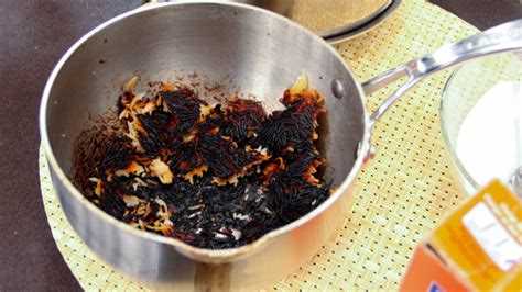 Use a Plastic Scraper to Remove Stubborn Burnt Caramel